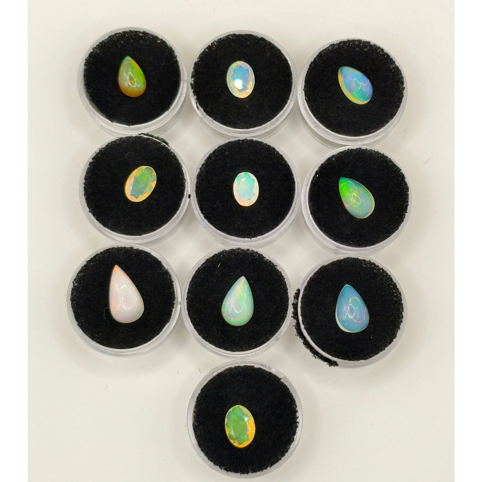 10-Piece 18.60ctw Ethiopian Welo Opal Cabochon & Faceted Gem Lot with Display Caps