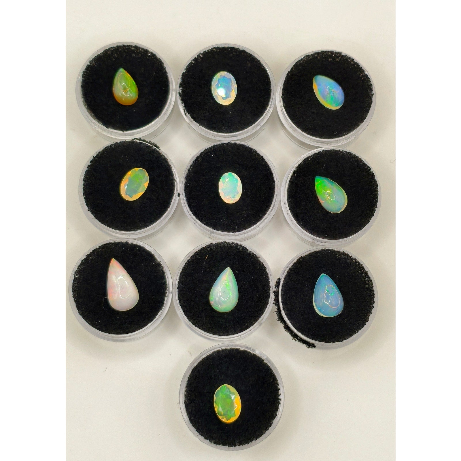 10-Piece 18.60ctw Ethiopian Welo Opal Cabochon & Faceted Gem Lot with Display Caps
